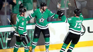 DALLAS, TX - NOVEMBER 16: Jason Dickinson #16 of the Dallas Stars celebrates with Miro Heiskanen #4 of the Dallas Stars and Mattias Janmark #13 of the Dallas Stars after scoring the game winning goal against the Boston Bruins in over time at American Airlines Center on November 16, 2018 in Dallas, Texas. (Photo by Tom Pennington/Getty Images)