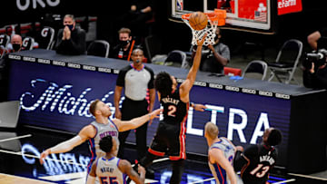 Jan 18, 2021; Miami, Florida, USA; Miami Heat guard Gabe Vincent (2) shoots the ball past Detroit Pistons forward Blake Griffin (23) during the first half at American Airlines Arena. Mandatory Credit: Jasen Vinlove-USA TODAY Sports