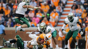 KNOXVILLE, TN - NOVEMBER 3: Tyler Fain #62 of the Charlotte 49ers rumps in the air as Running back Madre London #31 of the Tennessee Volunteers is tackled during the game between the Charlotte 49ers and the Tennessee Volunteers at Neyland Stadium on November 3, 2018 in Knoxville, Tennessee. Tennessee won the game 14-3. (Photo by Donald Page/Getty Images)