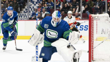 VANCOUVER, BC - FEBRUARY 08: Goalie Jacob Markstrom #25 of the Vancouver Canucks makes a pad save against the Calgary Flames during NHL action at Rogers Arena on February 8, 2020 in Vancouver, Canada. (Photo by Rich Lam/Getty Images)
