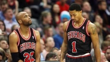 Nov 21, 2013; Denver, CO, USA; Chicago Bulls guard Derrick Rose (1) and forward Taj Gibson (22) during the second half against the Denver Nuggets at Pepsi Center. The Nuggets won 97-87. Mandatory Credit: Chris Humphreys-USA TODAY Sports
