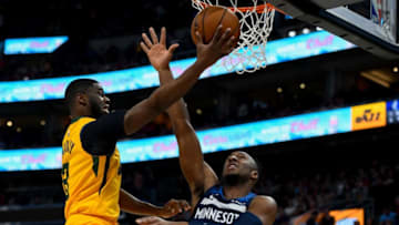 SALT LAKE CITY, UT - NOVEMBER 18: Emmanuel Mudiay #8 of the Utah Jazz attempts a shot over Josh Okogie #20 of the Minnesota Timberwolves during a game at Vivint Smart Home Arena on November 18, 2019 in Salt Lake City, Utah. NOTE TO USER: User expressly acknowledges and agrees that, by downloading and/or using this photograph, user is consenting to the terms and conditions of the Getty Images License Agreement. (Photo by Alex Goodlett/Getty Images)