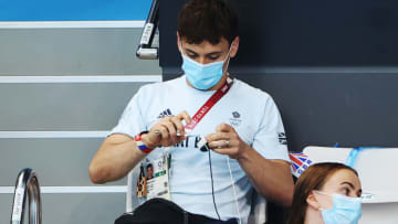 TOKYO, JAPAN - AUGUST 03: Tom Daley of Great Britain is seen in the stands during the Men's 3m Springboard final on day eleven of the Tokyo 2020 Olympic Games at Tokyo Aquatics Centre on August 03, 2021 in Tokyo, Japan. (Photo by Ian MacNicol/Getty Images)