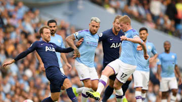 MANCHESTER, ENGLAND - AUGUST 17: Christian Eriksen of Tottenham Hotspur challenges for the ball with Nicolas Otamendi and Kevin De Bruyne of Manchester City during the Premier League match between Manchester City and Tottenham Hotspur at Etihad Stadium on August 17, 2019 in Manchester, United Kingdom. (Photo by Shaun Botterill/Getty Images)