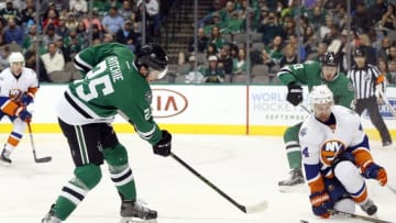 Mar 19, 2016; Dallas, TX, USA; Dallas Stars right wing Brett Ritchie (25) shoots on New York Islanders defenseman Calvin de Haan (44) in the second period at American Airlines Center. Mandatory Credit: Tim Heitman-USA TODAY Sports
