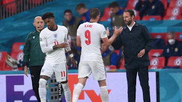 LONDON, ENGLAND - JUNE 18: Harry Kane of England interacts with Gareth Southgate, Head Coach of England as he is substituted during the UEFA Euro 2020 Championship Group D match between England and Scotland at Wembley Stadium on June 18, 2021 in London, England. (Photo by Laurence Griffiths/Getty Images)