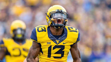 Oct 1, 2016; Morgantown, WV, USA; West Virginia Mountaineers cornerback Rasul Douglas (13) reacts after making a tackle during the first quarter against the Kansas State Wildcats at Milan Puskar Stadium. Mandatory Credit: Ben Queen-USA TODAY Sports