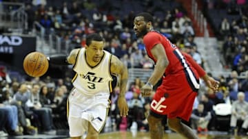 Feb 18, 2016; Washington, DC, USA; Utah Jazz guard Trey Burke (3) dribbles past Washington Wizards guard John Wall (2) during the second half at Verizon Center. The Washington Wizards won 103-89. Mandatory Credit: Brad Mills-USA TODAY Sports