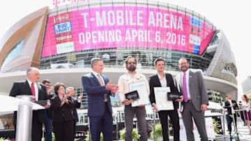 LAS VEGAS, NEVADA - APRIL 06: Clark County Commission Chairman Steve Sisolak (L), Clark County Commissioner Mary Beth Scow (2nd L), MGM Resorts International Chairman and CEO Jim Murren (3rd L) and AEG President and CEO Dan Beckerman (R) speak as drummer Ronnie Vannucci Jr. (3rd R) and frontman Brandon Flowers (2nd R) of The Killers are given ceremonial crystal keys to the Las Vegas Strip during the T-Mobile Arena grand opening news conference on the Las Vegas Strip on April 6, 2016 in Las Vegas, Nevada. (Photo by Ethan Miller/Getty Images for MGM Resorts International)