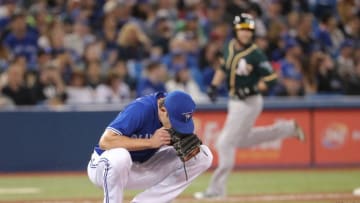 TORONTO, ON - MAY 19: Tyler Clippard #36 of the Toronto Blue Jays reacts after giving up a grand slam home run to Chad Pinder #18 of the Oakland Athletics in the eighth inning during MLB game action to at Rogers Centre on May 19, 2018 in Toronto, Canada. (Photo by Tom Szczerbowski/Getty Images)