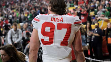 Jan 1, 2016; Glendale, AZ, USA; Ohio State Buckeyes defensive lineman Joey Bosa (97) leaves the game after being ejected for a targeting penalty during the first half of the 2016 Fiesta Bowl against the Notre Dame Fighting Irish at University of Phoenix Stadium. Mandatory Credit: Joe Camporeale-USA TODAY Sports