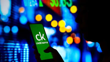 BRAZIL - 2022/04/06: In this photo illustration, a woman's silhouette holds a smartphone with the Credit Karma logo displayed on the screen. (Photo Illustration by Rafael Henrique/SOPA Images/LightRocket via Getty Images)