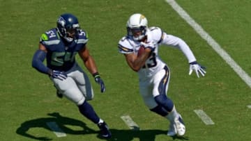Sep 14, 2014; San Diego, CA, USA; San Diego Chargers wide receiver Keenan Allen (13) runs after making a catch as Seattle Seahawks middle linebacker Bobby Wagner (54) defends during the first quarter at Qualcomm Stadium. Mandatory Credit: Jake Roth-USA TODAY Sports