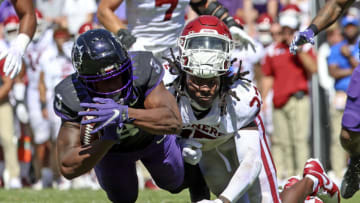 Oct 1, 2022; Fort Worth, Texas, USA; Oklahoma Sooners defensive back Justin Harrington (37) has his helmet knocked off by TCU Horned Frogs running back Emari Demercado (3) during the second half at Amon G. Carter Stadium. Mandatory Credit: Kevin Jairaj-USA TODAY Sports