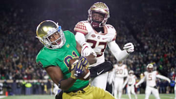 SOUTH BEND, IN - NOVEMBER 10: Miles Boykin #81 of the Notre Dame Fighting Irish makes a three-yard touchdown reception against Hamsah Nasirildeen #23 of the Florida State Seminoles in the first quarter of the game at Notre Dame Stadium on November 10, 2018 in South Bend, Indiana. (Photo by Joe Robbins/Getty Images)