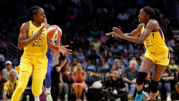 LOS ANGELES, CALIFORNIA - JULY 18: Forward Chiney Ogwumike #13 passes the ball to Nneka Ogwumike #30 of the Los Angeles Sparks in the game against the Dallas Wings at Staples Center on July 18, 2019 in Los Angeles, California. NOTE TO USER: User expressly acknowledges and agrees that, by downloading and or using this photograph, User is consenting to the terms and conditions of the Getty Images License Agreement. (Photo by Meg Oliphant/Getty Images)