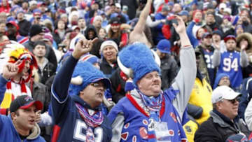 Nov 9, 2014; Orchard Park, NY, USA; Buffalo Bills fans celebrate after a touchdown against the Kansas City Chiefs during the first half at Ralph Wilson Stadium. Mandatory Credit: Kevin Hoffman-USA TODAY Sports