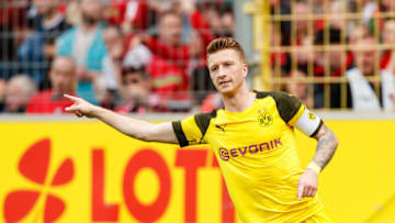 FREIBURG IM BREISGAU, GERMANY - APRIL 21: Marco Reus of Borussia Dortmund celebrates after scoring his team's second goal during the Bundesliga match between Sport-Club Freiburg and Borussia Dortmund at Schwarzwald-Stadion on April 21, 2019 in Freiburg im Breisgau, Germany. (Photo by TF-Images/Getty Images)