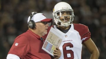 August 30, 2015; Oakland, CA, USA; Arizona Cardinals head coach Bruce Arians (left) instructs quarterback Logan Thomas (6) during the fourth quarter in a preseason NFL football game against the Oakland Raiders at O.co Coliseum. The Cardinals defeated the Raiders 30-23. Mandatory Credit: Kyle Terada-USA TODAY Sports