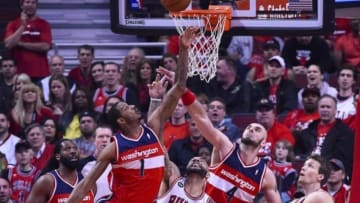 Apr 29, 2014; Chicago, IL, USA; Washington Wizards forward Trevor Ariza (1), center Marcin Gortat (4), and Chicago Bulls forward Carlos Boozer (5) battle for a rebound during the first quarter in game five of the first round of the 2014 NBA Playoffs at United Center. Mandatory Credit: Mike DiNovo-USA TODAY Sports