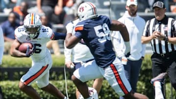 Auburn football wide receiver Malcolm Johnson Jr. (16) runs the ball after a catch during the A-Day spring practice at Jordan-Hare Stadium in Auburn, Ala., on Saturday, April 9, 2022.
