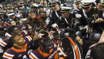 BLACKSBURG, VA - OCTOBER 20: Members of the Virginia Tech Hokies celebrate with the Corps of Cadets following the victory against the Miami Hurricanes at Lane Stadium on October 20, 2016 in Blacksburg, Virginia. (Photo by Michael Shroyer/Getty Images)