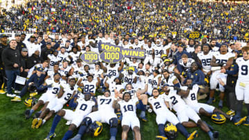 Nov 18, 2023; College Park, Maryland, USA; Michigan Wolverines celebrate the 1000th win in program history after the game against the Maryland Terrapins at SECU Stadium. Mandatory Credit: Brad Mills-USA TODAY Sports