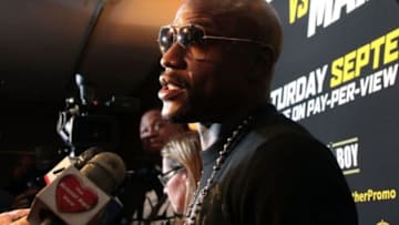 Jul 14, 2014; New York, NY, USA; Floyd Mayweather Jr. answers questions from media during press conference at Times Square. Mandatory Credit: Noah K. Murray-USA TODAY Sports