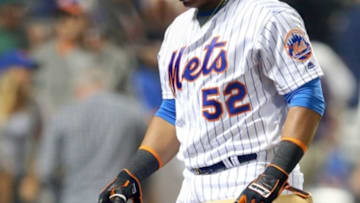 Sep 20, 2016; New York City, NY, USA; New York Mets left fielder Yoenis Cespedes (52) reacts as he walks back to the dugout after striking out to end the game again the Atlanta Braves at Citi Field. Mandatory Credit: Brad Penner-USA TODAY Sports
