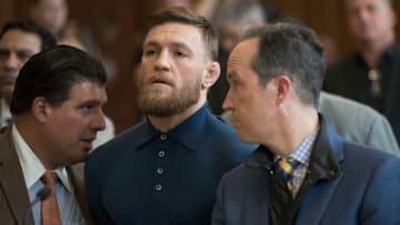 NEW YORK, NY - APRIL 06: Ultimate fighting star Conor McGregor stands with his lawyer Jim Walden during an arraignment in Brooklyn Criminal court on April 6, 2018 in New York City. McGregor is facing criminal charges in the wake of a backstage melee he allegedly instigated that has forced the removal of three fighters from UFC's biggest card of the year. Video footage appears to show the promotion's most bankable star throwing a hand truck at a bus full of fighters after a Thursday news conference for UFC 223 at Brooklyn's Barclays Center. (Photo by Mary Altaffer-Pool/Getty Images)