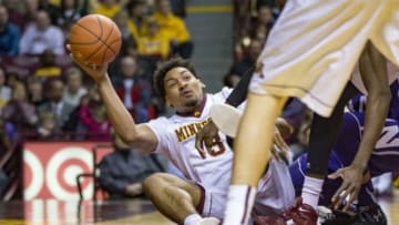 Jan 9, 2016; Minneapolis, MN, USA; Minnesota Golden Gophers forward Jordan Murphy (3) passes a loose ball from the floor in the first half against the Northwestern Wildcats at Williams Arena. Mandatory Credit: Jesse Johnson-USA TODAY Sports