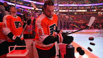 Mar 5, 2023; Philadelphia, Pennsylvania, USA; Philadelphia Flyers defenseman Ivan Provorov (9) pushes the pucks onto the ice before warmups against the Detroit Red Wings at Wells Fargo Center. Mandatory Credit: Eric Hartline-USA TODAY Sports