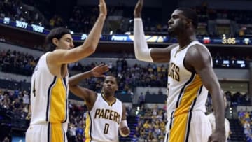Oct 29, 2014; Indianapolis, IN, USA; Indiana Pacers center Roy Hibbert (55) high fives forward Luis Scola (4) after scoring and getting fouled against the Philadelphia 76ers at Bankers Life Fieldhouse. Indiana defeats Philadelphia 103-91. Mandatory Credit: Brian Spurlock-USA TODAY Sports
