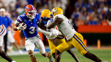 Sep 9, 2023; Gainesville, Florida, USA; Florida Gators wide receiver Eugene Wilson III (3) evades McNeese State Cowboys defensive back Johnquai Lewis (7) and McNeese State Cowboys defensive back Jaylen Jackson (10) during the first half at Ben Hill Griffin Stadium. Mandatory Credit: Matt Pendleton-USA TODAY Sports
