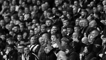 WOLVERHAMPTON, ENGLAND - OCTOBER 02: (EDITORS NOTE - This image has been converted to black and white) Newcastle United fans react during the Premier League match between Wolverhampton Wanderers and Newcastle United at Molineux on October 02, 2021 in Wolverhampton, England. (Photo by Naomi Baker/Getty Images)