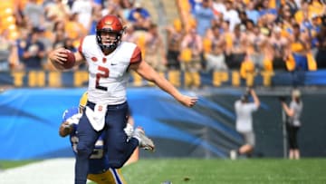 PITTSBURGH, PA - OCTOBER 06: Eric Dungey #2 of the Syracuse Orange runs out of bound as Elijah Zeise #25 of the Pittsburgh Panthers attempts a tackle in the first quarter during the game at Heinz Field on October 6, 2018 in Pittsburgh, Pennsylvania. (Photo by Justin Berl/Getty Images)