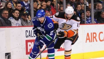 Nov 20, 2014; Vancouver, British Columbia, CAN; Anaheim Ducks forward Ryan Kesler (17) reaches over Vancouver Canucks forward Henrik Sedin (33) during the first period at Rogers Arena. Mandatory Credit: Anne-Marie Sorvin-USA TODAY Sports