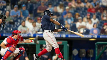 May 21, 2021; Philadelphia, Pennsylvania, USA; Boston Red Sox first baseman Danny Santana (22) hits a home run during the fifth inning against the Philadelphia Phillies at Citizens Bank Park. Mandatory Credit: Gregory Fisher-USA TODAY Sports