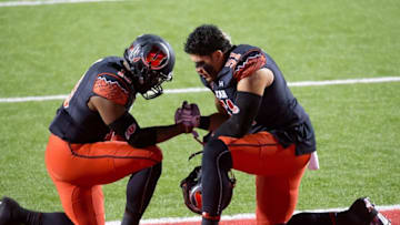 Nov 8, 2014; Salt Lake City, UT, USA; Utah Utes linebacker Gionni Paul (left) and defensive end Jason Fanaika (51) prior to the game against the Oregon Ducks at Rice-Eccles Stadium. Oregon won 51-27. Mandatory Credit: Russ Isabella-USA TODAY Sports