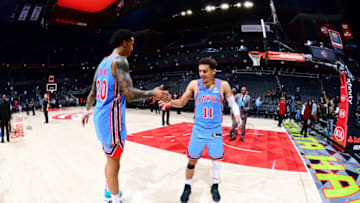 John Collins #20 of the Atlanta Hawks and Trae Young #11 of the Atlanta Hawks (Photo by Scott Cunningham/NBAE via Getty Images)