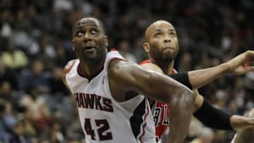 Feb 25, 2014; Atlanta, GA, USA; Atlanta Hawks power forward Elton Brand (42) and Chicago Bulls power forward Taj Gibson (22) fight for a rebound in the second quarter at Philips Arena. Mandatory Credit: Brett Davis-USA TODAY Sports