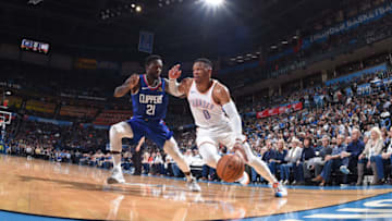 OKLAHOMA CITY, OK - OCTOBER 30: Russell Westbrook #0 of the Oklahoma City Thunder drives to the basket around Patrick Beverley #21 of the LA Clippers on October 30, 2018 at Chesapeake Energy Arena in Oklahoma City, Oklahoma. NOTE TO USER: User expressly acknowledges and agrees that, by downloading and/or using this photograph, user is consenting to the terms and conditions of the Getty Images License Agreement. Mandatory Copyright Notice: Copyright 2018 NBAE (Photo by Andrew D. Bernstein/NBAE via Getty Images)
