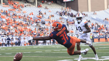 CHAMPAIGN, ILLINOIS - SEPTEMBER 10: Devon Witherspoon #31 of the Illinois Fighting Illini attempts to interception a pass in the game against the Virginia Cavaliers during the fourth quarter at Memorial Stadium on September 10, 2022 in Champaign, Illinois. (Photo by Justin Casterline/Getty Images)