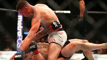 March 5, 2016; Las Vegas, NV, USA; Nate Diaz (top) against Conor McGregor during UFC 196 at MGM Grand Garden Arena. Mandatory Credit: Mark J. Rebilas-USA TODAY Sports