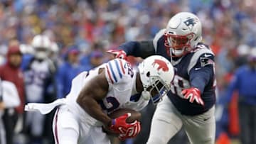 Oct 30, 2016; Orchard Park, NY, USA; Buffalo Bills running back Reggie Bush (22) makes a catch while being defended by New England Patriots linebacker Shea McClellin (58) during the first half at New Era Field. Mandatory Credit: Timothy T. Ludwig-USA TODAY Sports