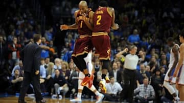 Feb 26, 2014; Oklahoma City, OK, USA; Cleveland Cavaliers point guard Jarrett Jack (1) celebrates a play with Cleveland Cavaliers point guard Kyrie Irving (2) in action against the Oklahoma City Thunder at Chesapeake Energy Arena. Mandatory Credit: Mark D. Smith-USA TODAY Sports