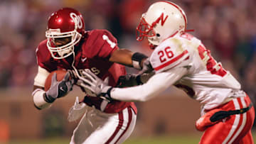 NORMAN, OK - NOVEMBER 13: Wide receiver Mark Bradley #1 of the University of Oklahoma Sooners runs upfield against defensive back Cortney Grixby #26 the University of Nebraska Cornhuskers during the game on November 13, 2004 at Memorial Stadium in Norman, Oklahoma. Oklahoma defeated Nebraska 30-3. (Photo by Ronald Martinez/Getty Images)