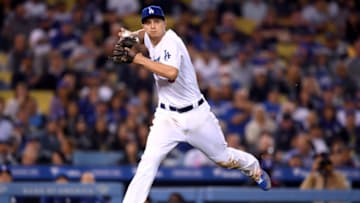 LOS ANGELES, CALIFORNIA - MAY 14: Corey Seager #5 of the Los Angeles Dodgers fields a groundball on the run, off the bat of Greg Garcia #5 of the San Diego Padres, during the eighth inning against the San Diego Padres at Dodger Stadium on May 14, 2019 in Los Angeles, California. (Photo by Harry How/Getty Images)