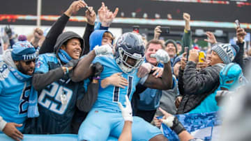 NASHVILLE, TN - DECEMBER 15: A.J. Brown #11 of the Tennessee Titans celebrates with the fans after scoring a touchdown in the second half of a game against the Houston Texans at Nissan Stadium on December 15, 2019 in Nashville, Tennessee. The Texans defeated the Titans 24-21. (Photo by Wesley Hitt/Getty Images)