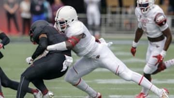 Jan 2, 2016; Orlando, FL, USA; Team Highlight outside line backer Ben Davis (right) tackles Team Armour running back Miles Sanders during the first half of the 2016 Under Armour All-American Game at Orlando Citrus Bowl. Mandatory Credit: Reinhold Matay-USA TODAY Sports